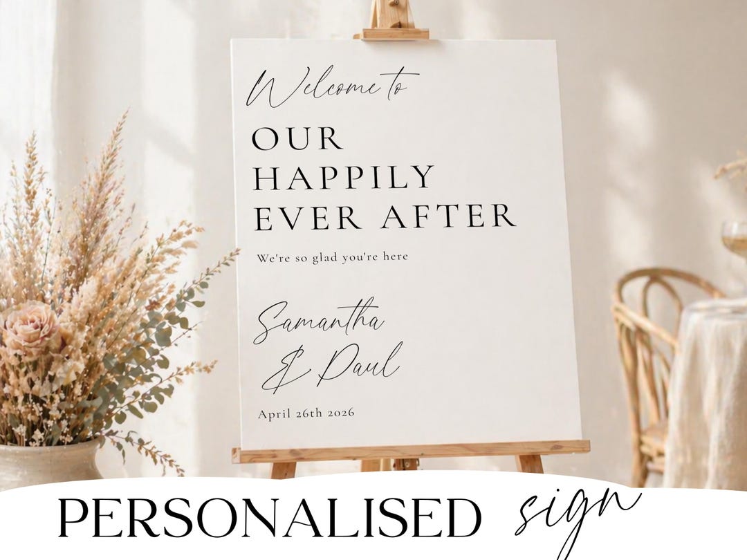 Personalised minimalist wedding welcome sign on wooden easel with names and date