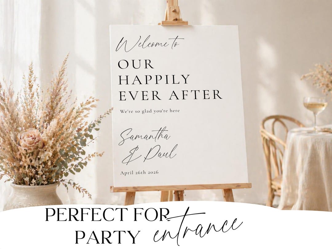 Minimalist wedding welcome sign styled with a vase of dried flowers