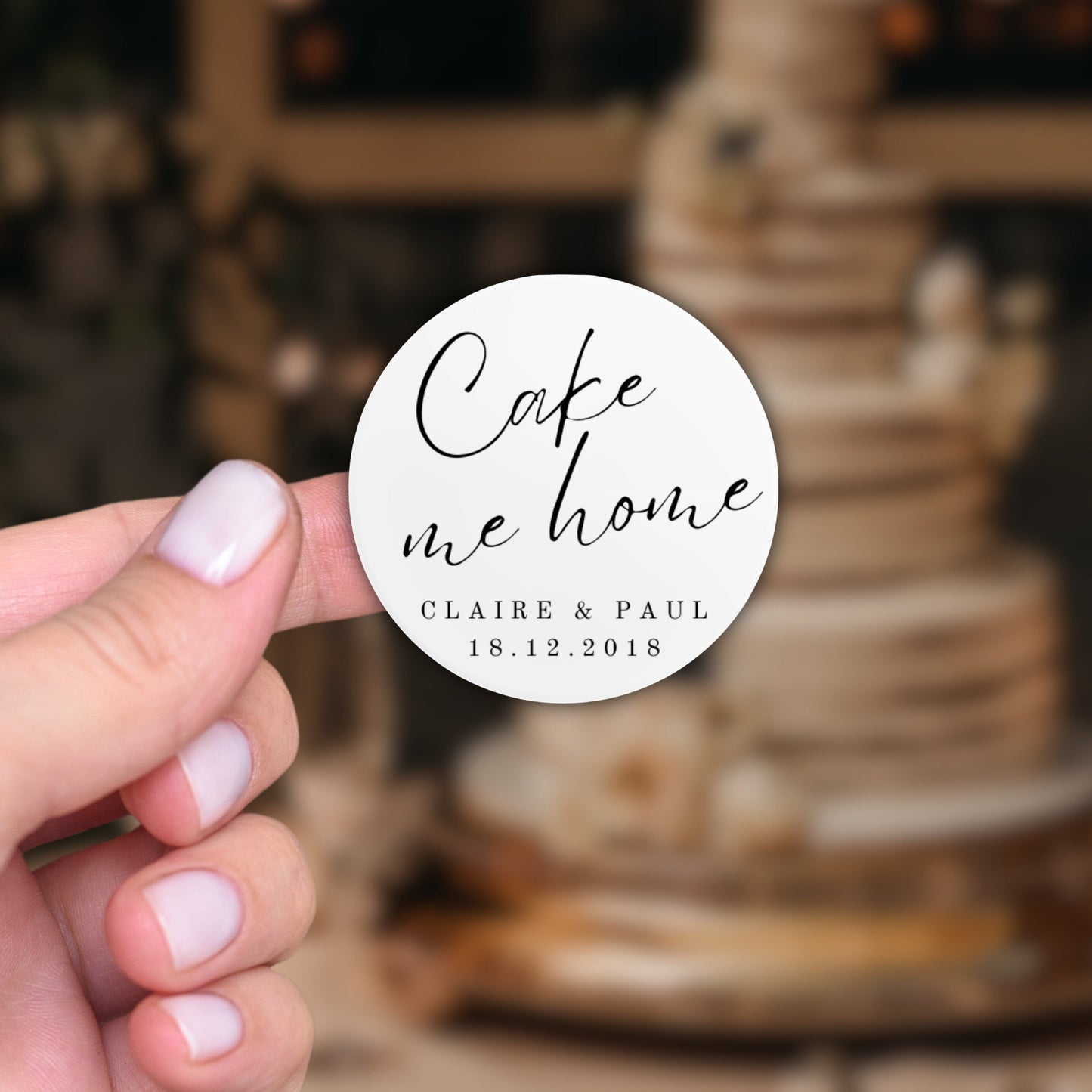 Round white matt sticker that reads 'Cake me home', with the couples name and wedding date on the bottom. For adding to wedding cake as favours for guests.