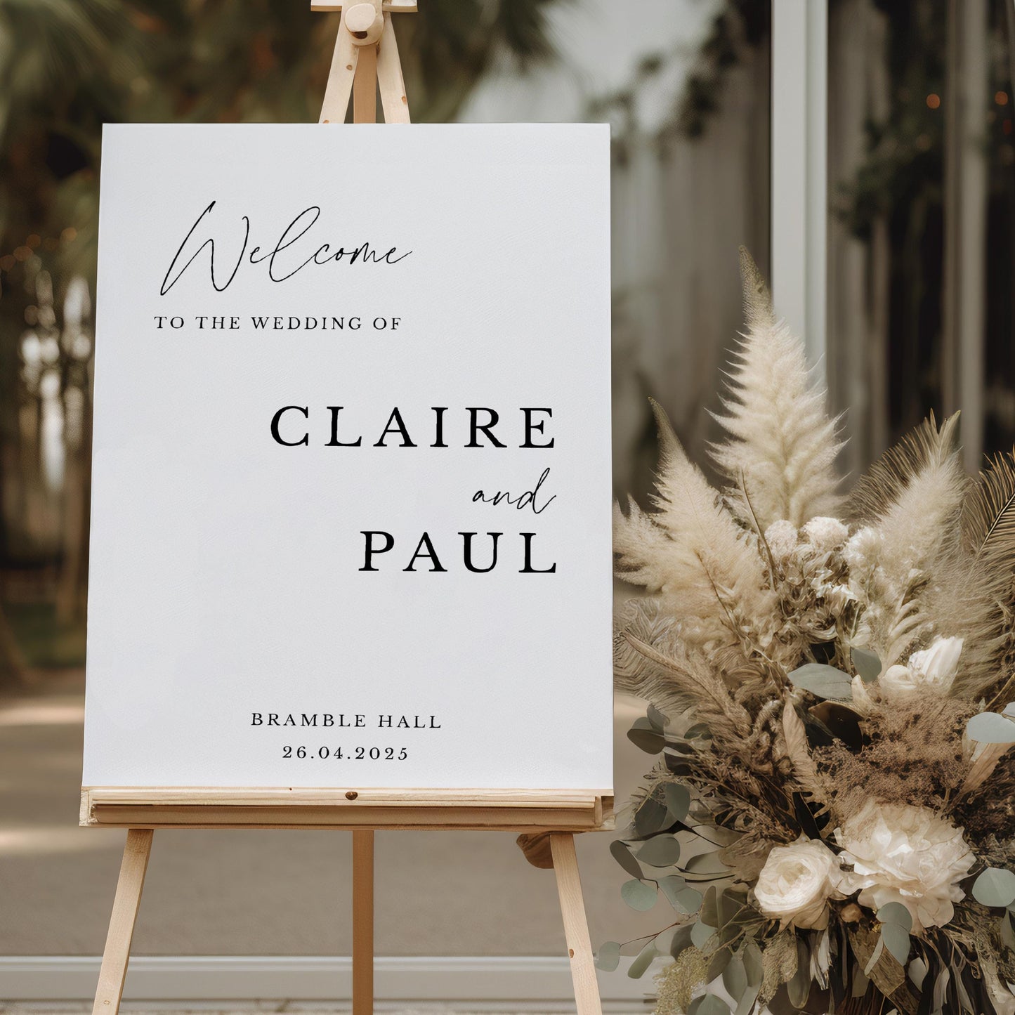 Modern script wedding welcome sign reading Welcome to the wedding with couple's names and date