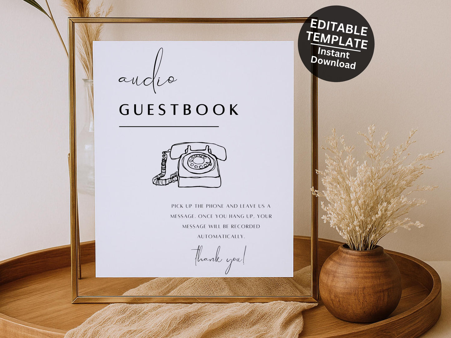 Framed 'Audio Guestbook' sign with decorative elements on a wooden tray.