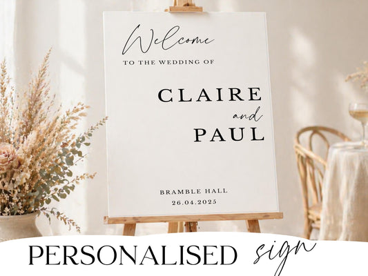 Personalised wedding welcome sign in modern script with dried florals on a wooden easel